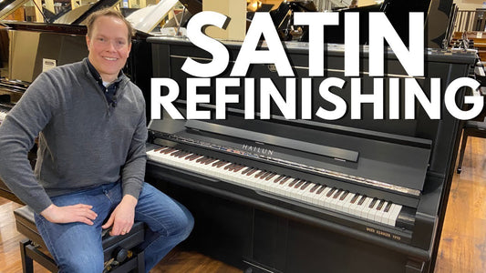 Brigham Larson sits next to a black upright Hailun piano. Title reads "Satin Refinishing"